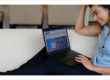 Woman on laptop scheduling home services and utilities
